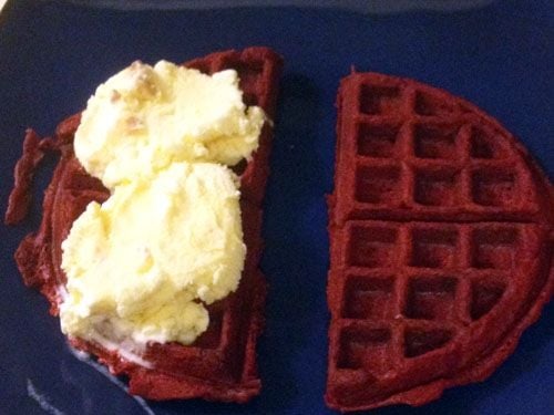 Cut the waffle in half and place two scoops of your favorite ice cream on one half of the waffle.