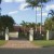 Sunnybank Home with white fence Sunnybank Home with white fence