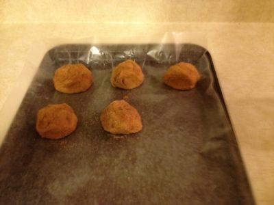 Step Thirteen: Place Coated Dough Balls on a Baking Sheet Lined with Wax Paper.
