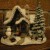 A Thomas Kinkade Christmas home with a snowman in front yard A Thomas Kinkade Christmas home with a snowman in front yard
