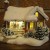 A Thomas Kinkade snow-covered home with a flickering fireplace and people inside A Thomas Kinkade snow-covered home with a flickering fireplace and people inside