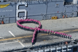 Sailors Stand in Pink Ribbon Formation at Sea
