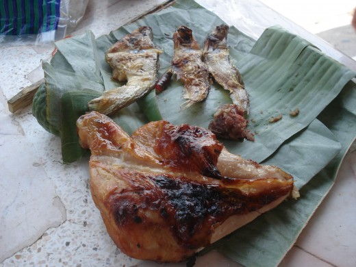 Piece of grilled Chicken 30 Baht, Four fish (I had eaten one) at 25 Baht. 55 Baht Total.
