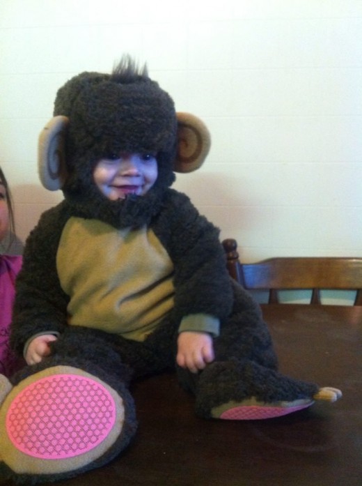 one of my twins in his 'too cute' monkey outfit