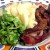 Seasoned meat, such as ribs, served with mashed potatoes and greens with a light vinaigrette is completely gluten-free, and oh so delicious.