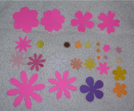 These are punched out shapes.  Work from largest shape on bottom of flower, adding consecutively smaller shapes as desired.