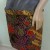 Fold the entire width on top of the sarong to keep it secure. Fold the entire width on top of the sarong to keep it secure.