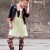 her wild hairstyle adds to her street style which is outlined by her playful neon green blouse. her wild hairstyle adds to her street style which is outlined by her playful neon green blouse.