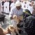 Omani Woman Inspecting Animals for Sale Omani Woman Inspecting Animals for Sale