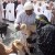 Another Oman woman choosing to buy the addition to her herd Another Oman woman choosing to buy the addition to her herd