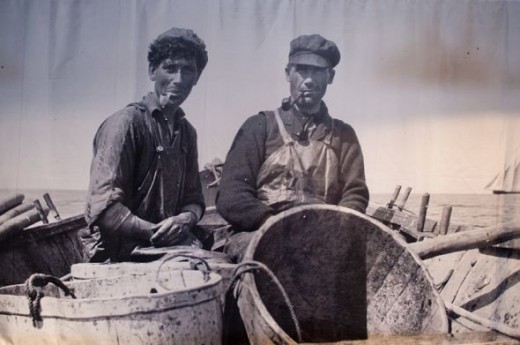 Two fishermen in their small boat.