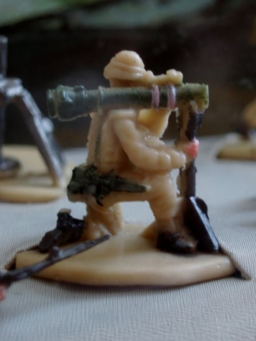 A soldier firing grenade launcher. From 94' Micro Machines #17 Infantry Attack set.