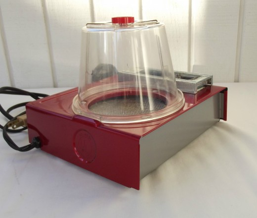 These machines were well-made and tasteful devices, and had a metallic candy apple red finish on the well-formed metal frame, and the futuristic plastic strange change chamber on the top.