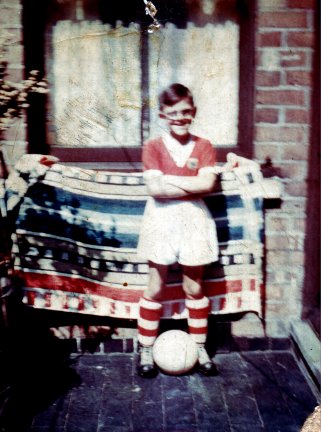 My young brother in his new Nottingham Forest football strip with the Pit towel behind him.