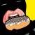 Batman pigging out on a chocolate-sprinkled doughnut. Batman pigging out on a chocolate-sprinkled doughnut.