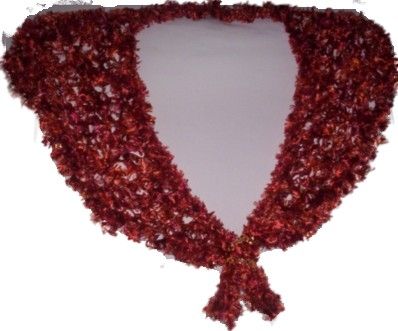 This shawl was handknitted using Autumn Rust 'Feathers' yarn in an open 'stretchy' pattern, up to 104cm (41") maximum width around shoulders x 35cm (13.5") max. depth at back point, and has clear Amber bicone bead trim crocheted in all around base, p