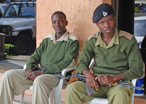 Two security men guarding a 5-star hotel in Arusha carrying loaded AK-47s