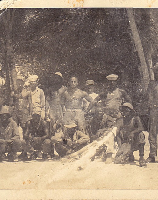  My father, on an island in the Pacific, before I was a twinkle in his eye. (the buff sailor in the middle)