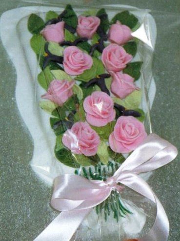 Bouquet cake, with roses, irises and leaves