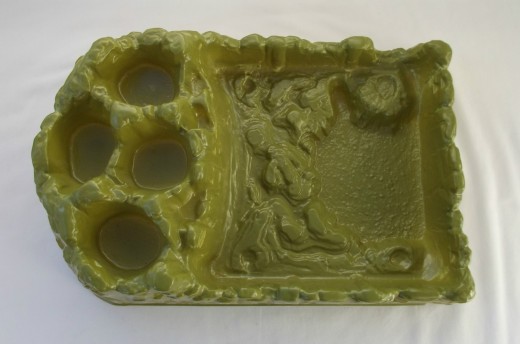 The play set has an awesome designed plastic vac u-formed in the shape of a swampy-green landscape that is a wonderful diorama model 