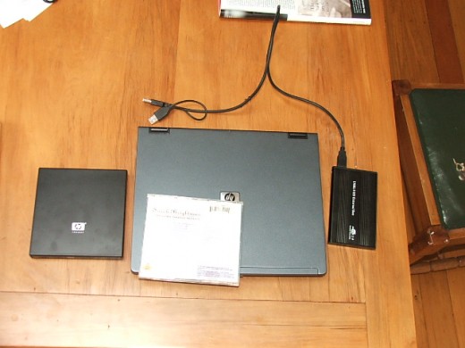 14" HP NC4200 laptop, external DVD and external hard drive. CD case for scale.