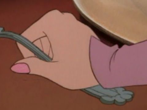 Sleeves end in small points over the backs of the hands