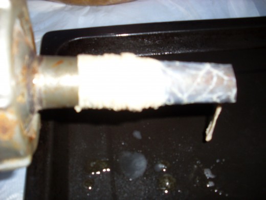 The casing put onto the funnel with the special hand-action described above.