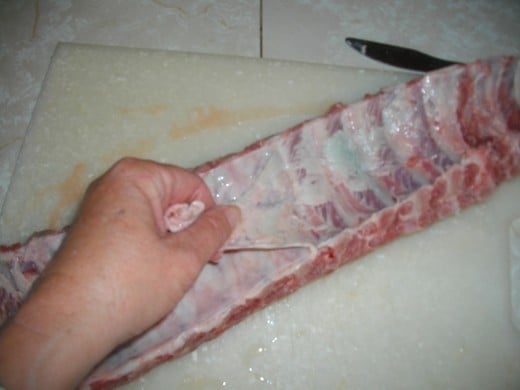 Remove membrane from bottom of ribs
