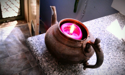 Teapot candle that is always alight at anniversaries and family celebrations in memory of our grandmothers.