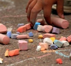 Drawing with Chalk on sidewalk