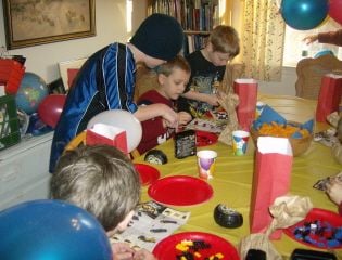 Here are the boys building their Lego cars