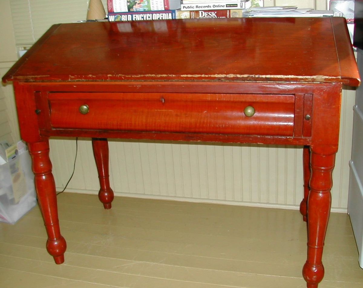 The cherry slant-top desk.