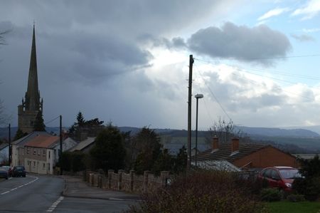 Looking towards the Welsh Mountains past the church