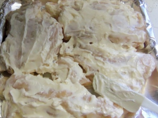 Spread the mayo over the chicken evenly.  Do not turn chicken over.