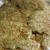 Spoon dry ingredients evenly over chicken, covering the entire piece on the top.