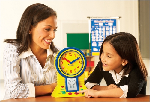Mom Teaches Girl To Tell Time On Toy Clock