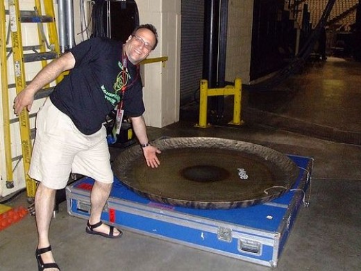 My fiance posing with Stewart's gong, ready to be packed up for the night!