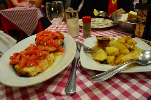 The complementary Bruschetta, an Italian rustic bread topped with simple juicy tomatoes and basil.