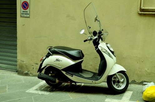 The Italian legend Vespa  got  parked in one of the lanes in Florence.