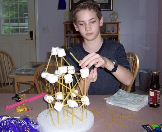 A homeschooled child with his building project.