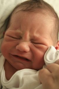 Babies cry for a certain reason. Since they can't communicate with us any other way, we have to try to find out why. It could be they are wet, hungry, have gas and need a back rub or burp, need to feel warm and comfortable, or are too warm.