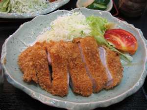 Japanese pork cutlets over shredded cabbage