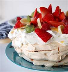 Pavlova (Meringue topped with whipped cream and fruit)