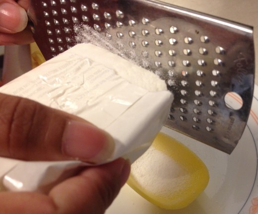Grating the bar soap for the dish soap recipe