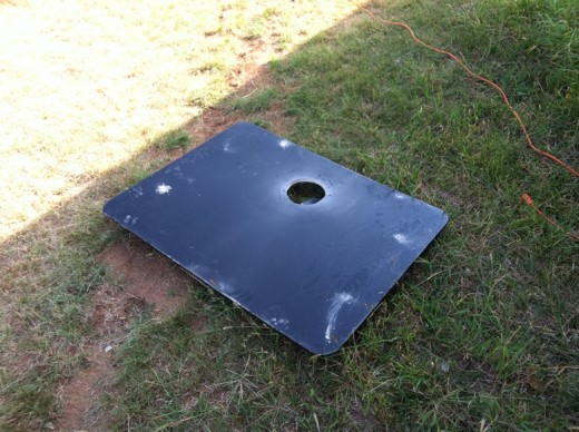 Cutting holes in the fireplace cover.