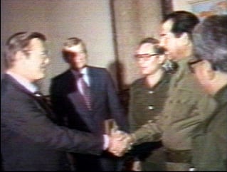Saddam Hussein shaking hands with Donald Rumsfeld, 1983