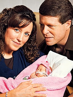 Michelle and Jim Bob Diggar with their Duaghter Josie. Josie weighed 2 pound 3 ounces when she arrived in to the world 14 weeks early. Michelle nearly died from preeclampsia. 