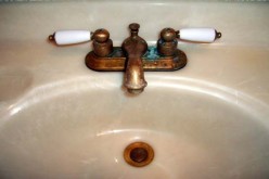 How to Clean Hard Water Buildup and Soap Scum from Showers, Tubs, and Bathroom Fixtures