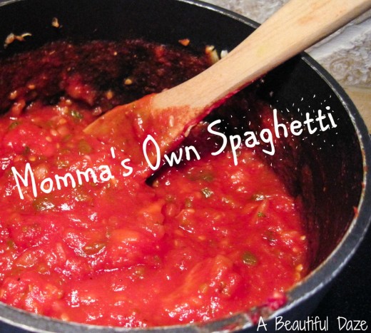 A delicious pot of spaghetti with the words Momma's Own Spaghetti floating across it.