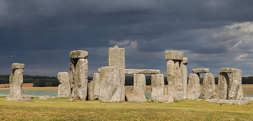 A dramatic picture of Stonehenge with storm clouds overhead